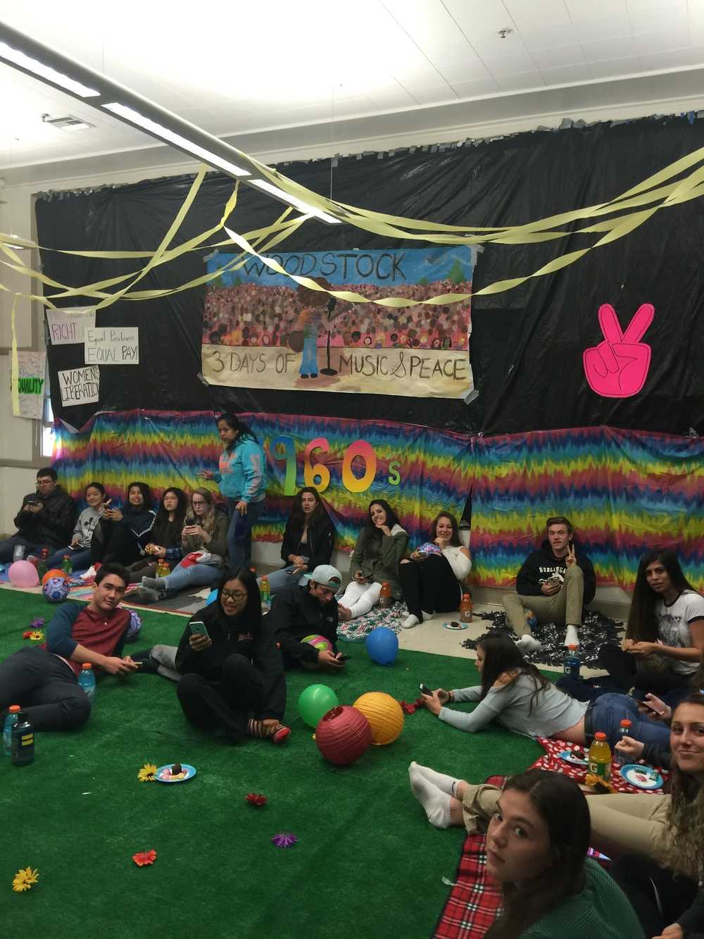  Rohrbach’s class enjoys the recreation of Woodstock music festival, complete with fake grass and a picnic. Photo courtesy of Jen Rohrbach 