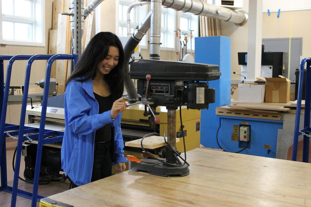  Former Exploring Tech student Nicole Chin practices using machinery in the tech lab. 