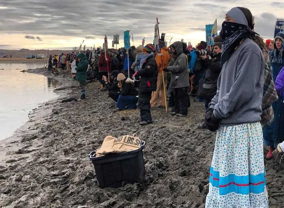 Protestors line along Lake Oahe, North Dakota to block the construction of the Dakota Access Pipeline. At the time this photo was taken, videos surfaced showing officers firing rubber bullets, deploying tear gas and spraying water at the protesters in freezing weather. 
