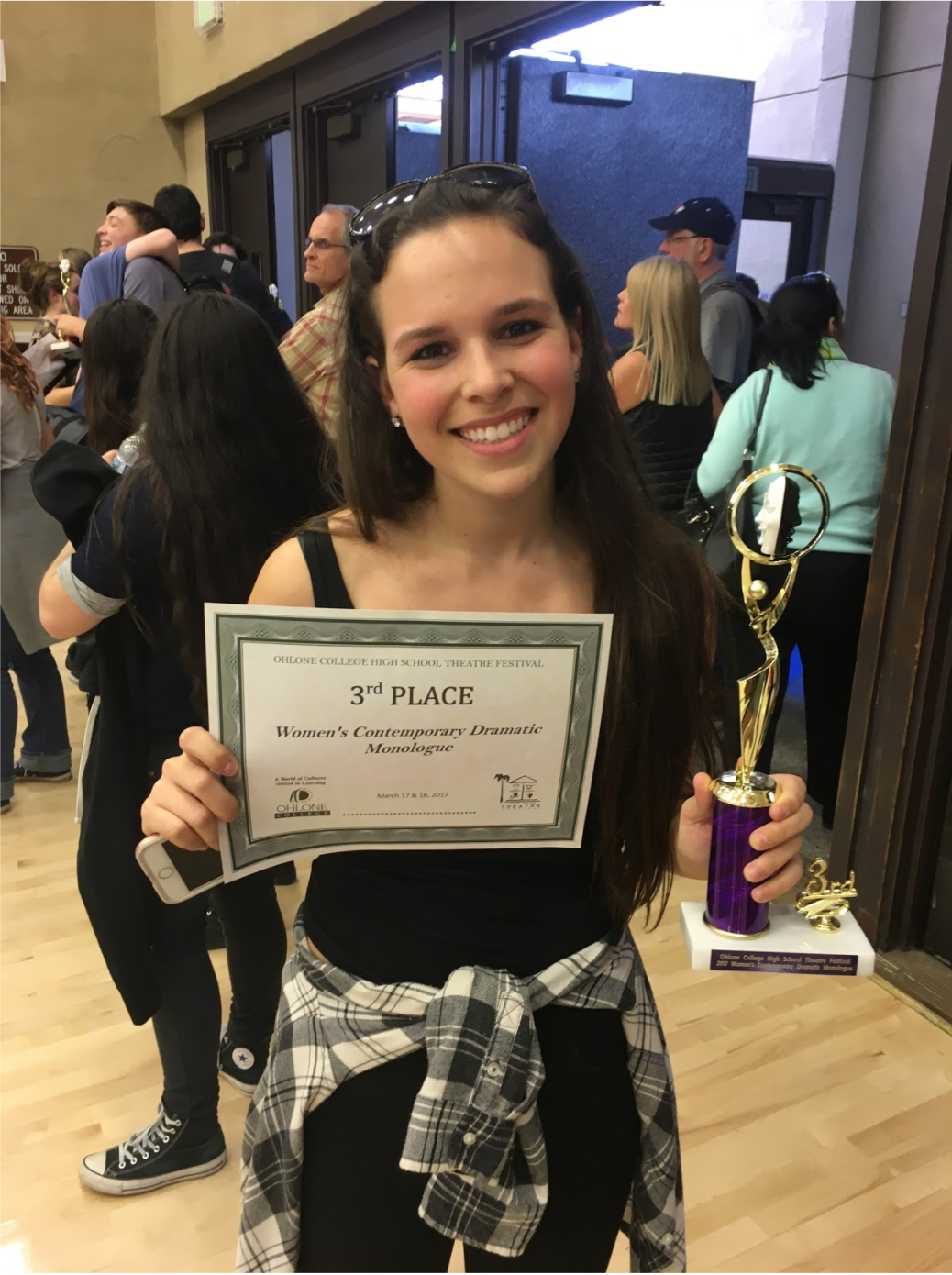  Senior Madelyn Levine smiles with her certificate and trophy. She won third place for her Contemporary Dramatic monologue from Girl . 