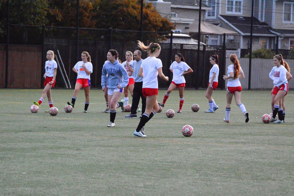 Girls varsity soccer practices for upcoming game as commitment in many sports on campus declines.