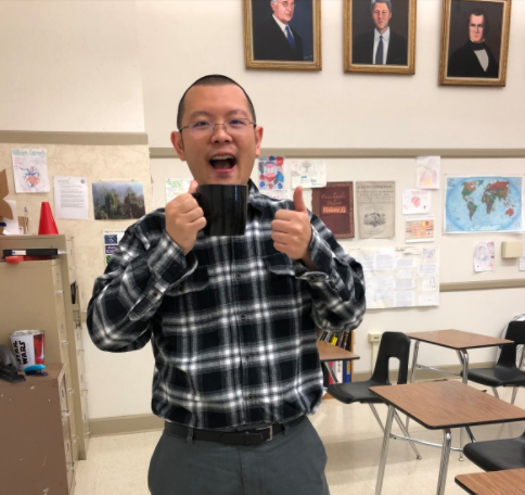  Chin poses in his classroom 