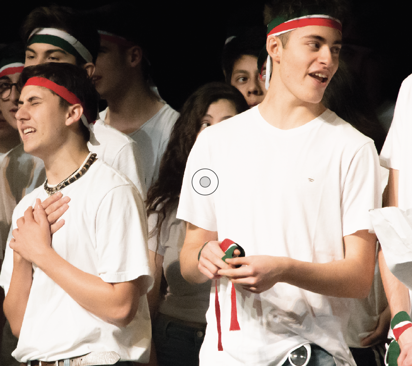  Senior Justin Cilia (Left) and Italian exchange student Andrea Giorgio (Right) sing the Italian political song “O Bella Ciao” during the International Assembly on March 20.The lyrics of the anthem honor partisans who rebelled against Nazi rule during World War II. Since then, politics have saturated Italian culture, yet a new wave of apathy has emerged in response to elections in recent years. 