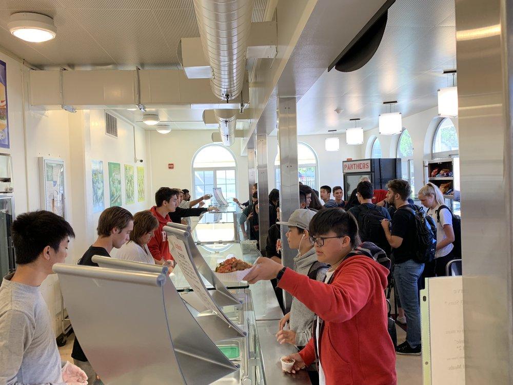 Students line up in the BHS cafeteria to receive their food.