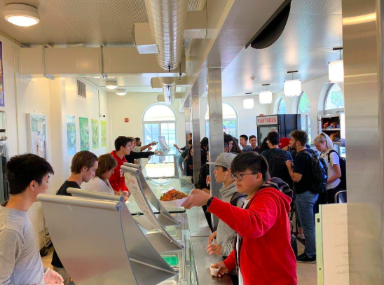 Students line up in the BHS cafeteria to receive their food.