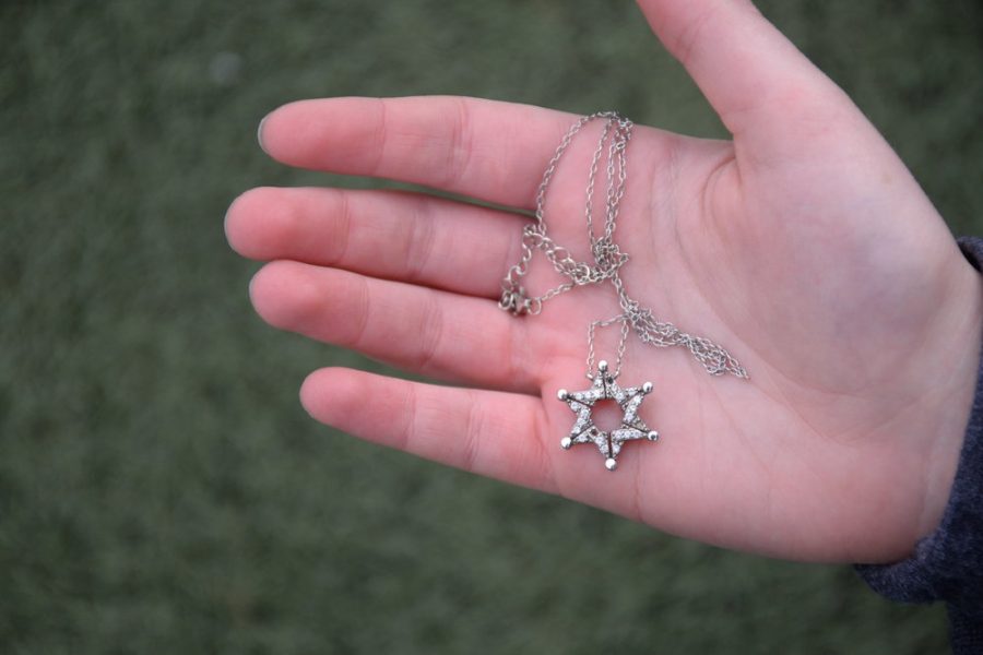 The+Star+of+David+is+recognized+as+a+symbol+of+Jewish+identity.+The+design+of+this+necklace%2C+belonging+to+freshman+Zoe+Steinberger%2C+has+a+story.+During+the+Spanish+Inquisition%2C+Jews+wore+Star+of+David+necklaces+which+could+unfold+as+butterflies+in+order+to+conceal+their+true+religious+meaning.+Steinbergers+necklace+is+a+modern+replication+of+this+design.