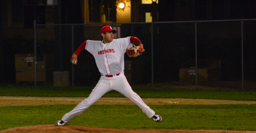  Senior Emilio Flores throws a pitch during a 5-0 win over Mills.