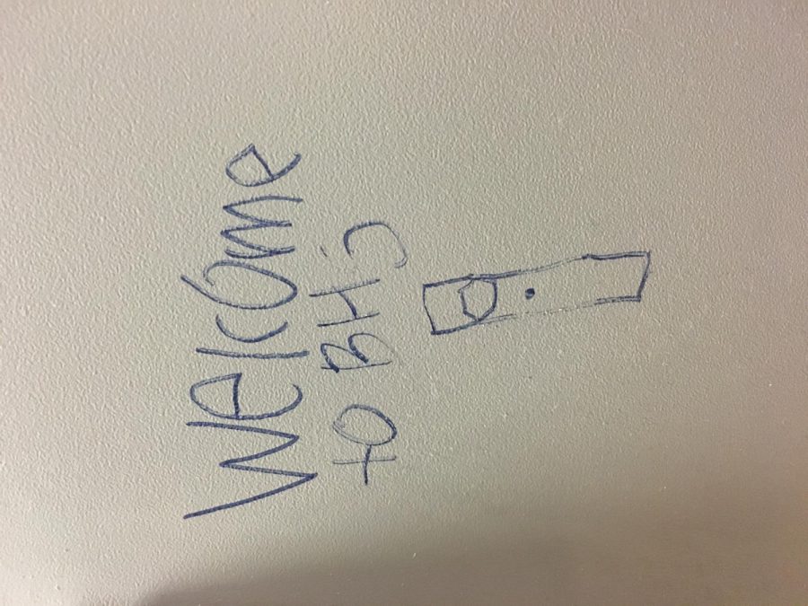 Graffiti found in the girl’s C building bathroom depicting the words “Welcome to BHS,” with a Juul below the text.