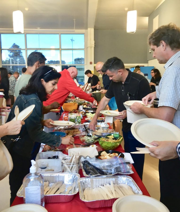 Families and teachers kick off the school year with the annual Back-to-School Potluck.