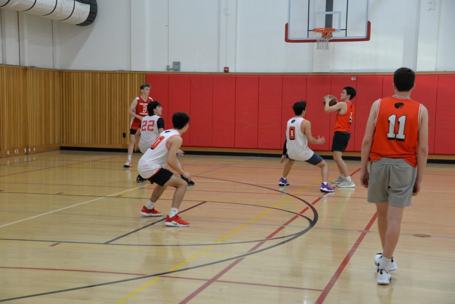 Sophomore Sean Richardson looking to make a play while being defended by fellow sophomore Jacob Yamagishi.