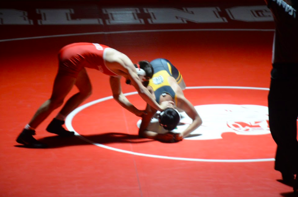 Kyle Botelho pushes his opponent away as Burlingame hosted Terra Nova in a dual meet.