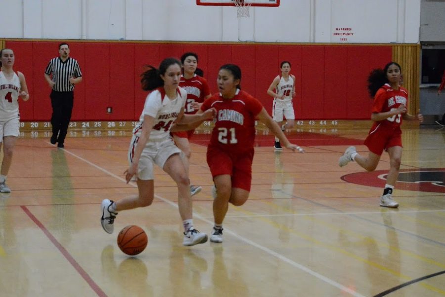Brianna Grossman pushes past an El Camino defender at their second CCS game on Feb. 22 at Burlingame.