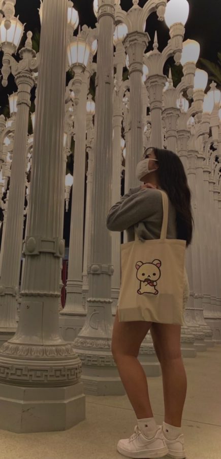 Arriana+Cruz+poses+with+a+custom-made+bag+that+she+painted+a+Japanese+bear+named+Korilakkuma+on.