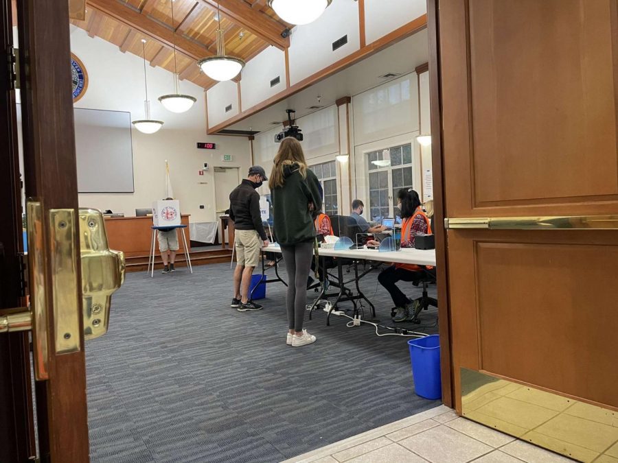 Senior Dalton Boyse patiently waits to cast her ballot at Hillsborough City Hall.