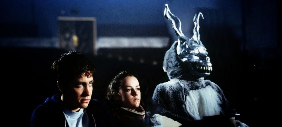 A scene from “Donnie Darko” where Donnie is being visited by Frank, a satanic bunny-like figure, at a movie theatre.