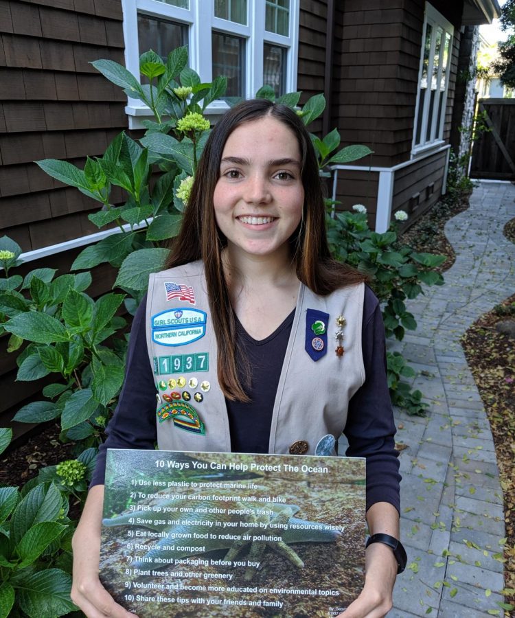 Senior Gemma Rice poses with her environmental sustainability sign for the Fitzgerald Marine Reserve kiosk on July 15, 2020. 