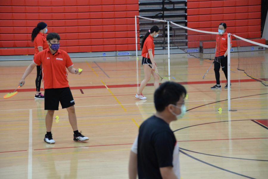 Players use available courts in between matches to practice playing against their teammates, in their most recent home game against Sequoia High School.