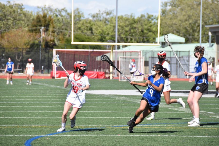 Sophomore Elise Ehrhardt races down the field as she cradles the ball.