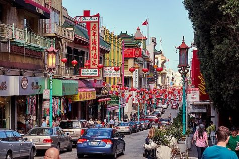 People mill around in Chinatown, San Francisco. Established in the 1850s, Chinatown is a cultural center with a densely populated area with 15,000 residents and many tourists.
