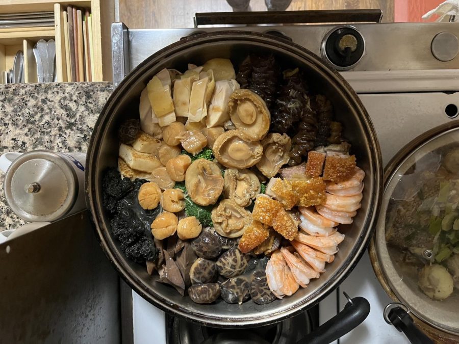 Poon Choi is a festive dish commonly served during Chinese New Year. It features a large pot filled with various vegetables, seafood and meat.