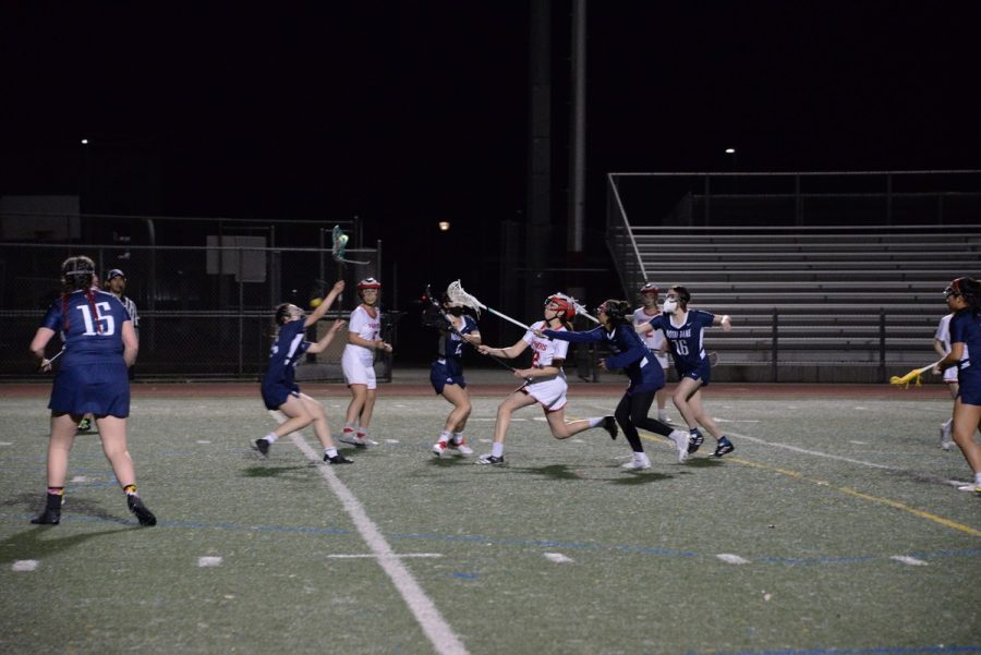Sophomore Gigi Bottarini rushes forward on an offensive possession against Notre Dame High School on March 1st.