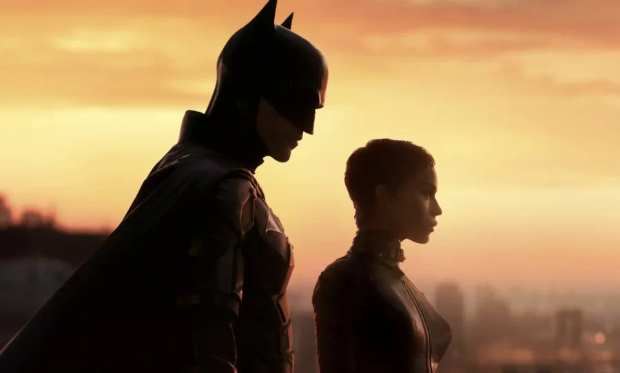 Batman (Robert Pattinson) and Catwoman (Zoë Kravitz) look down at Gotham City as they prepare to continue on with their lives and go their separate ways.