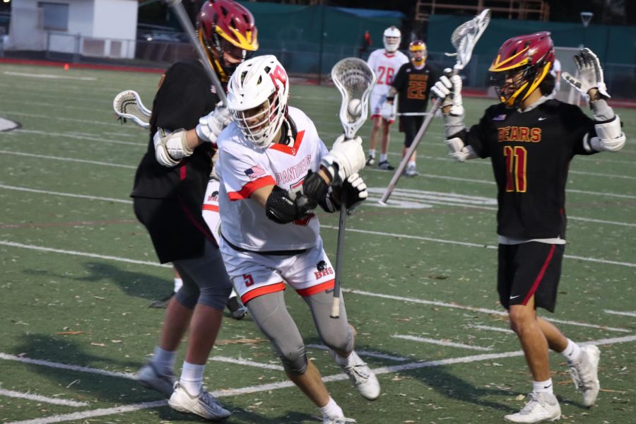 Senior midfielder Cole Jones bolts away with ball possession in a league game against Menlo-Atherton on April 12.