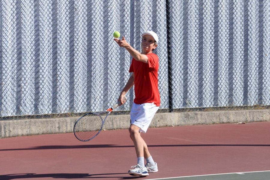 Junior Jackson Spenner serves in his 6-1, 6-1 win against Mills’ Nicholas Chang on April 19.