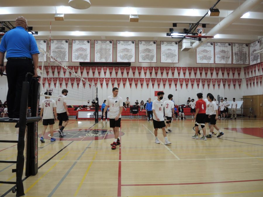 Burlingame players reposition for the next point during the second set in their March 21 match against Lowell High School.