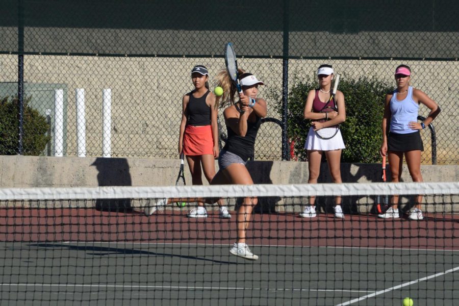 Senior Rorie Stone hits a backhand in the girls’ tennis practice on Aug. 25.