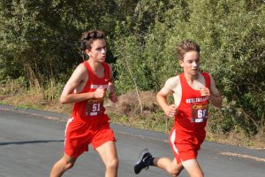 Varsity runners Jackson Spenner and Lucas Keeley make their way down the back straight of the course just before Cougar Hill.