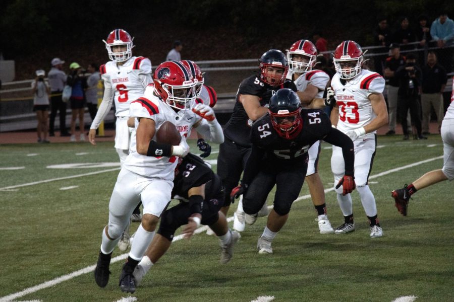 Senior and team captain Daniel Hilt runs through the Aragon defense in the first quarter of Thursday night’s match.