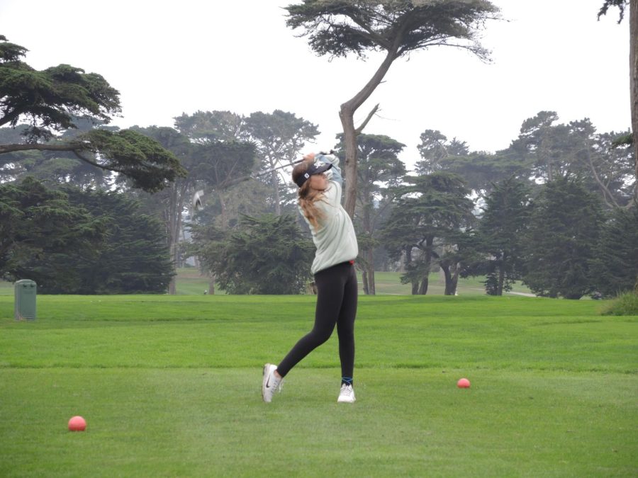 Senior Sophia Ibanez tees off at the ninth hole at Fleming 9 Course in San Francisco, during a match against South San Francisco High School on Tuesday, Oct. 11.