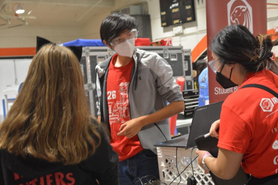 Drive team member Jason Zhai prepares the Iron Panthers robot at the CalGames off-season competition.