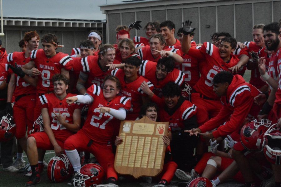 Burlingame varsity football team celebrates on the field after winning the Little Big Game on Nov. 5.