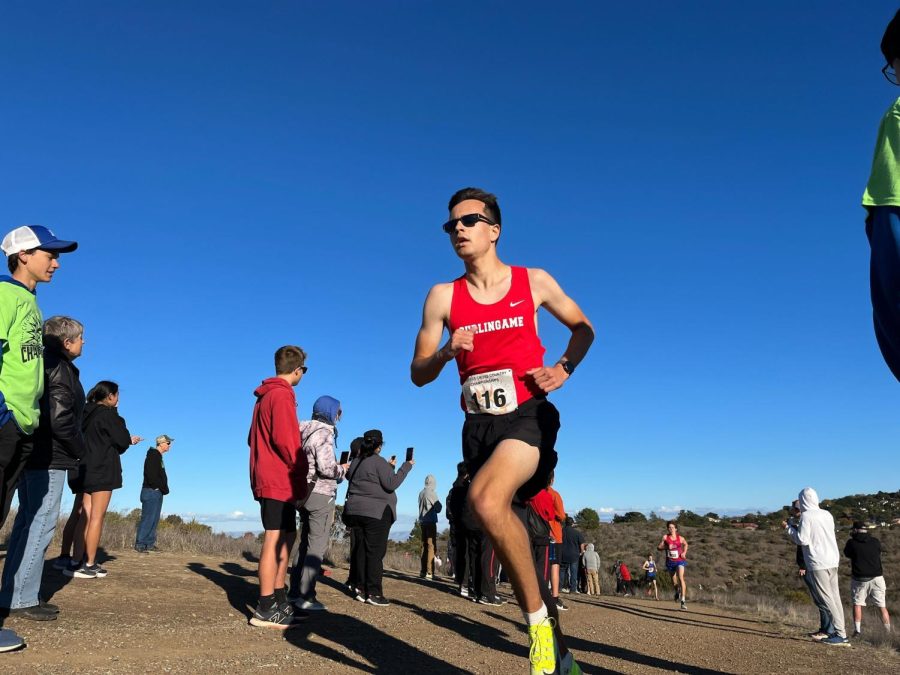 Senior Romer Rosales-Hasek reaches the top of Hallmark Park’s cardiac hill on Nov. 12 — a notorious challenge for runners in the last mile.
