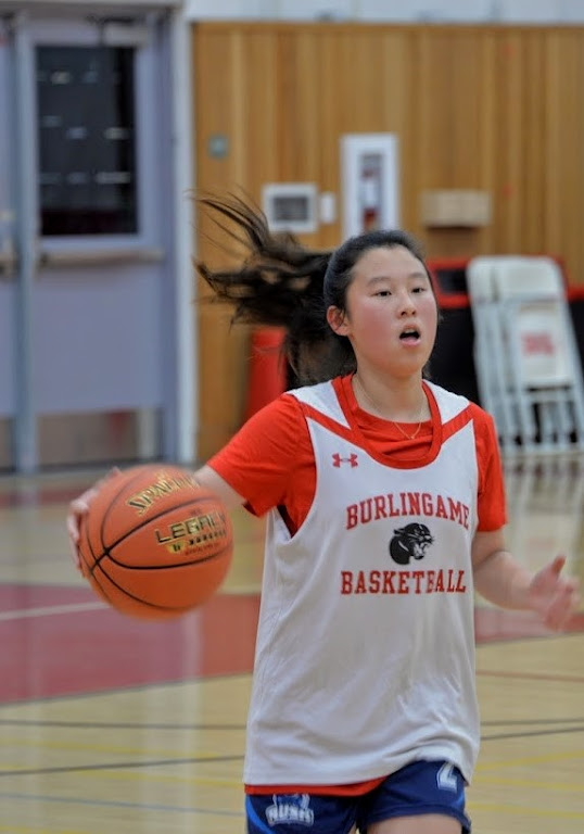 Senior and co-captain Joy Yeo handles the ball before passing it to a teammate. With nine new varsity players this season, the team will rely on veteran leadership.