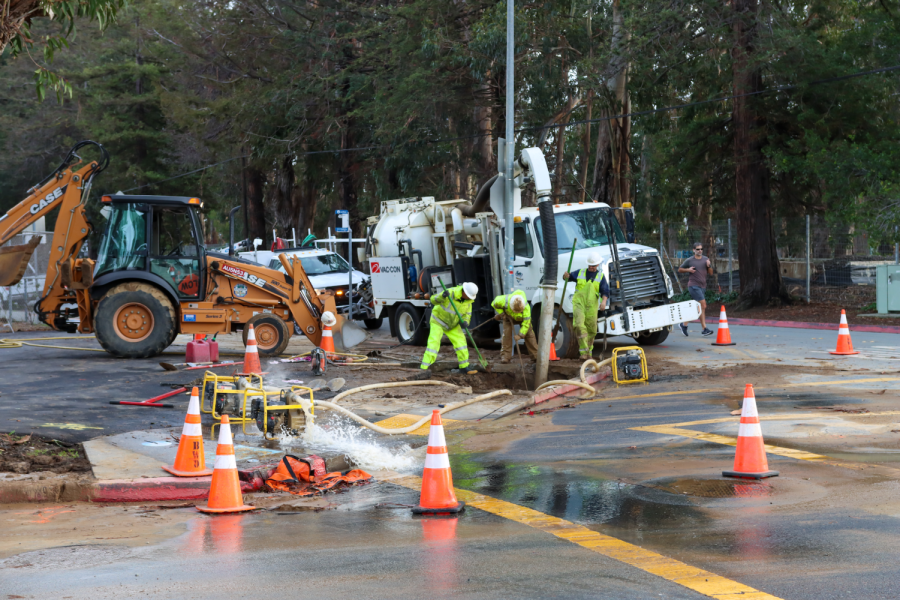 Workers repair a broken water main that was cutting off water to the school on Friday, Jan. 6.
