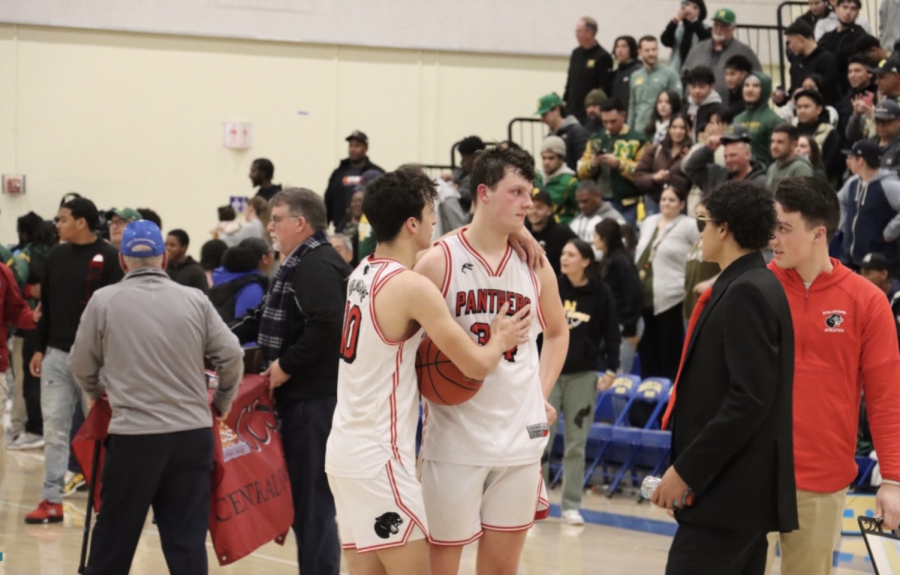 Senior guard Zaden Martin consoles senior center Kyle Haslam after Burlingame lost the Division III CCS Championship game against Monterey High School on Saturday, Feb. 25.