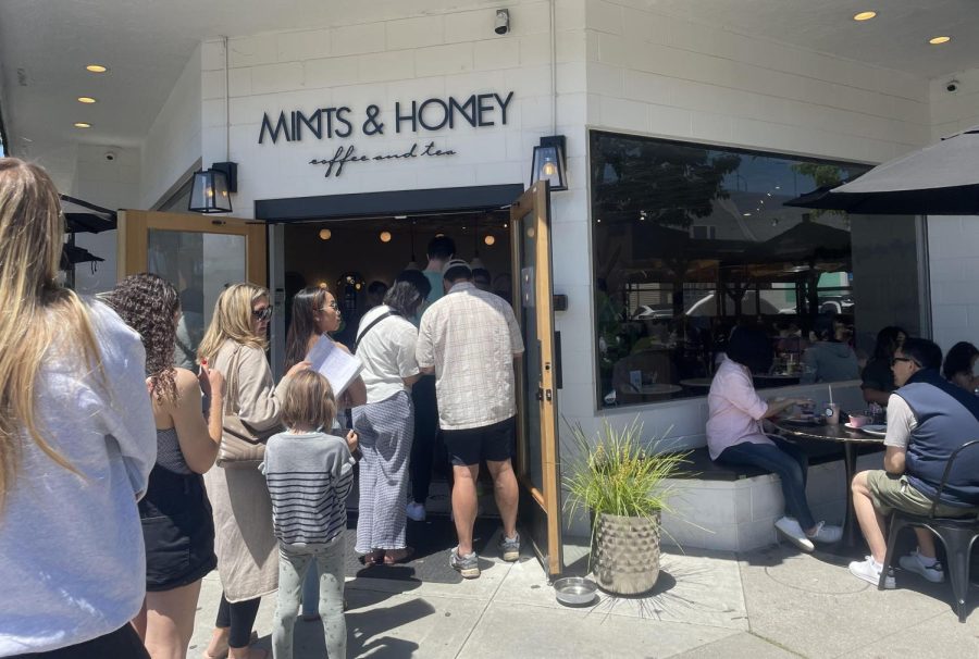 A long line of customers waits to be served outside Mints & Honey, located on Burlingame Avenue.