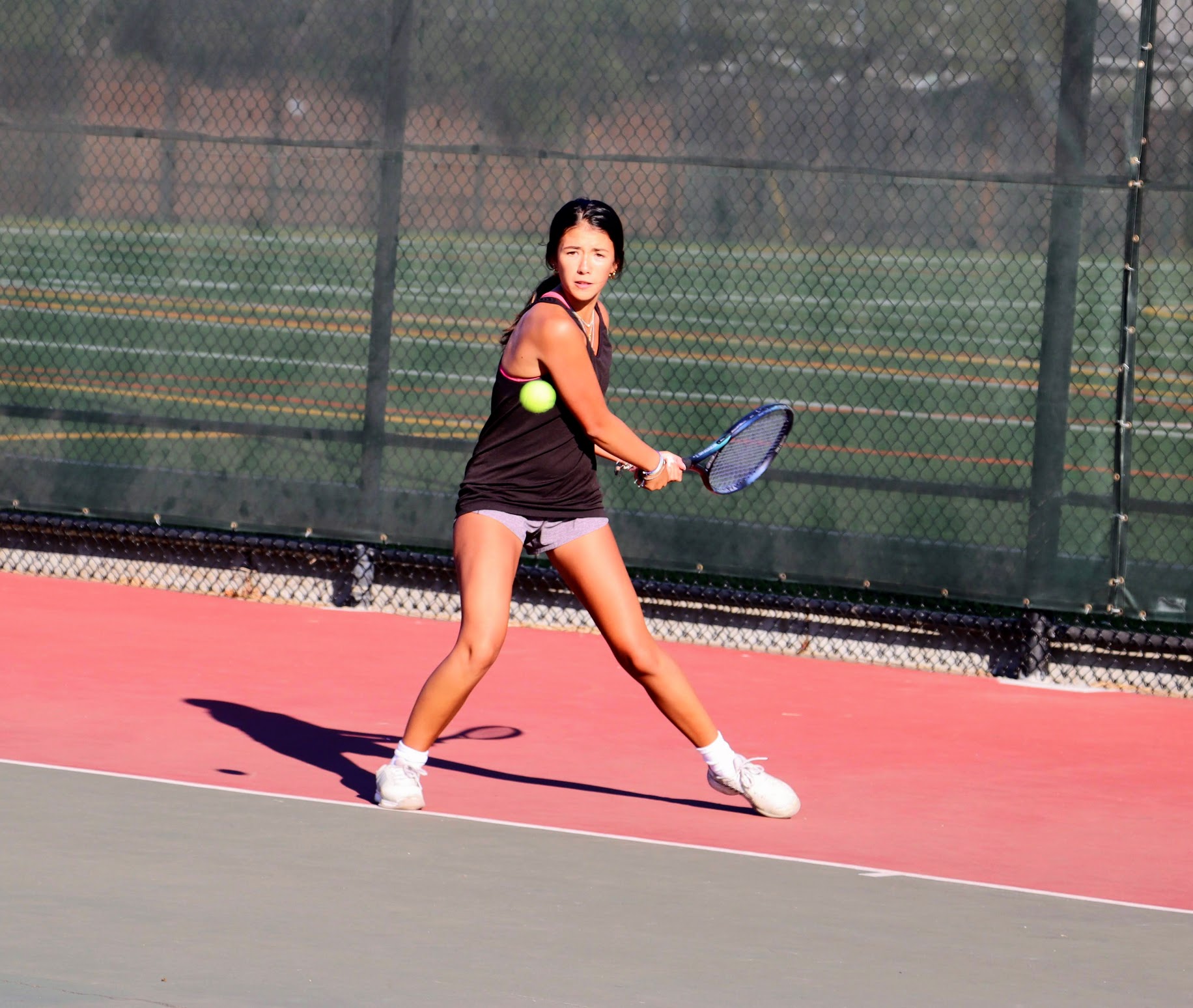 Junior Natalie Gyde hits a backhand during a singles match at the girls’ tennis practice on Thursday, Aug. 24.
