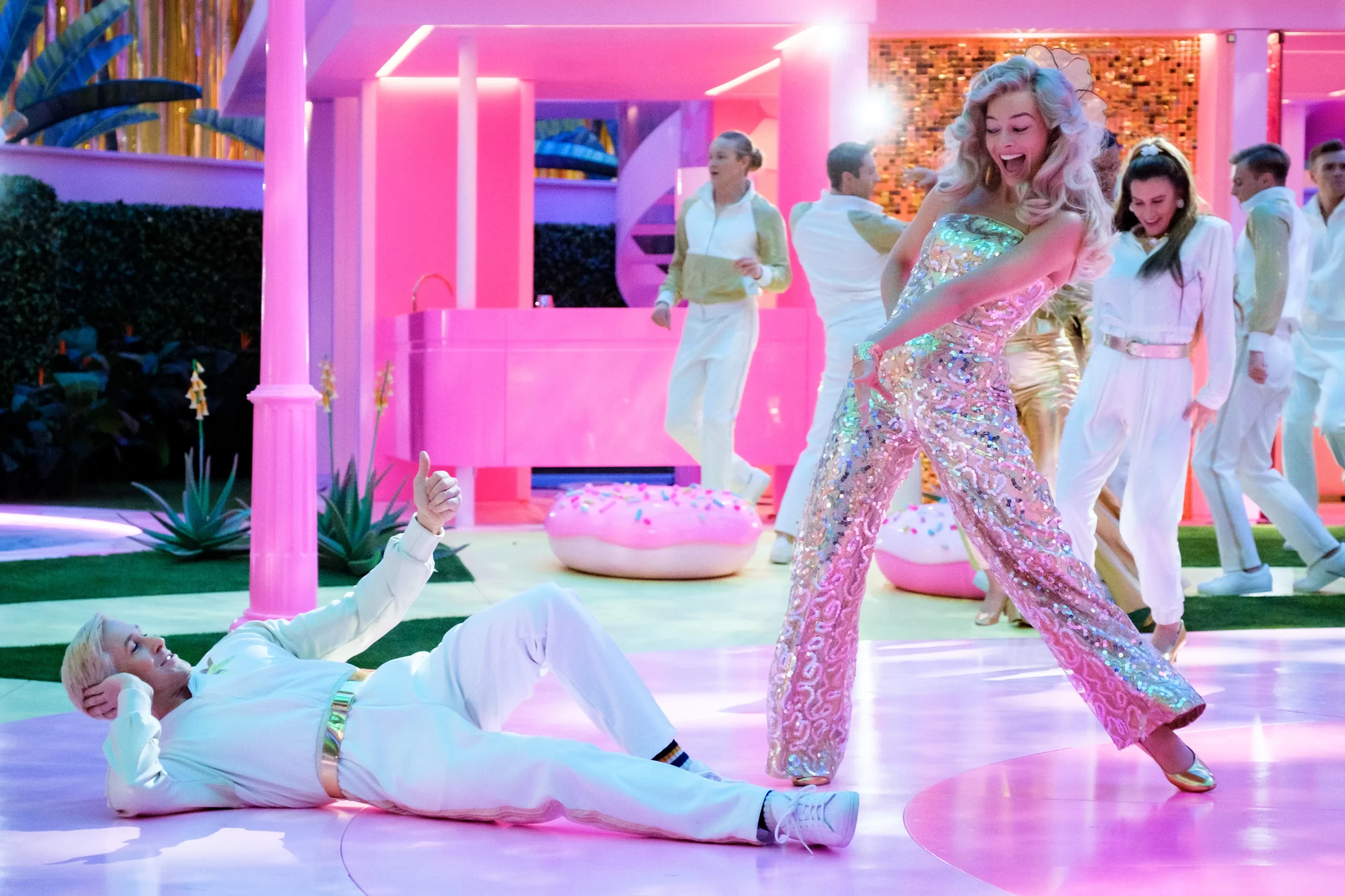 Barbie (Margot Robbie) and Ken (Ryan Gosling) launch into a dance number in the cinematic hit “Barbie”.