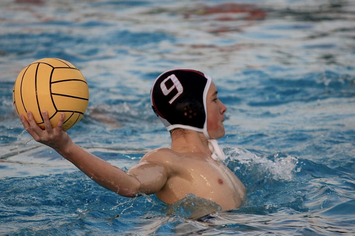 Sophomore Oliver Canniffe prepares to pass the ball to an open teammate in an attempt to create a scoring opportunity against Capuchino High School on Monday, Oct. 23.