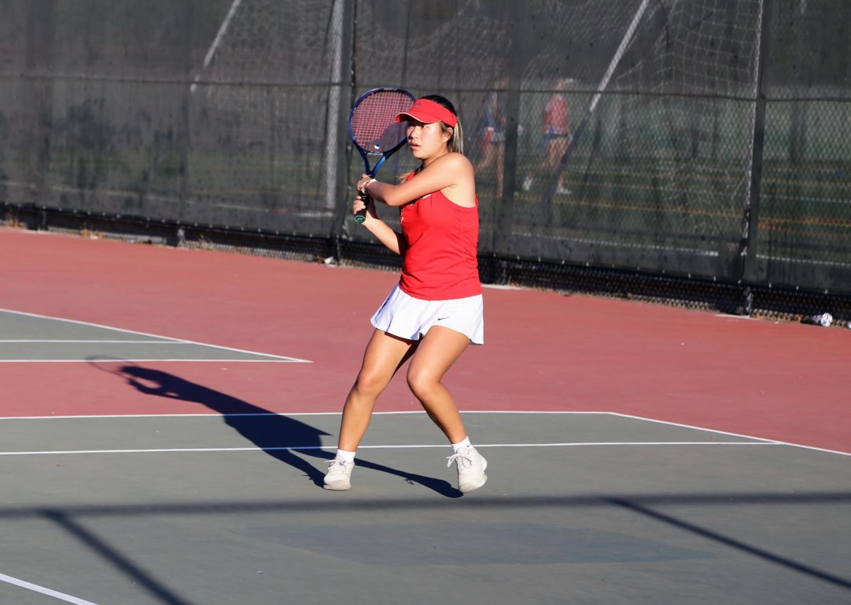 Junior Ella Wang hits a backhand in her match against Sequoia High School on Oct. 17.
