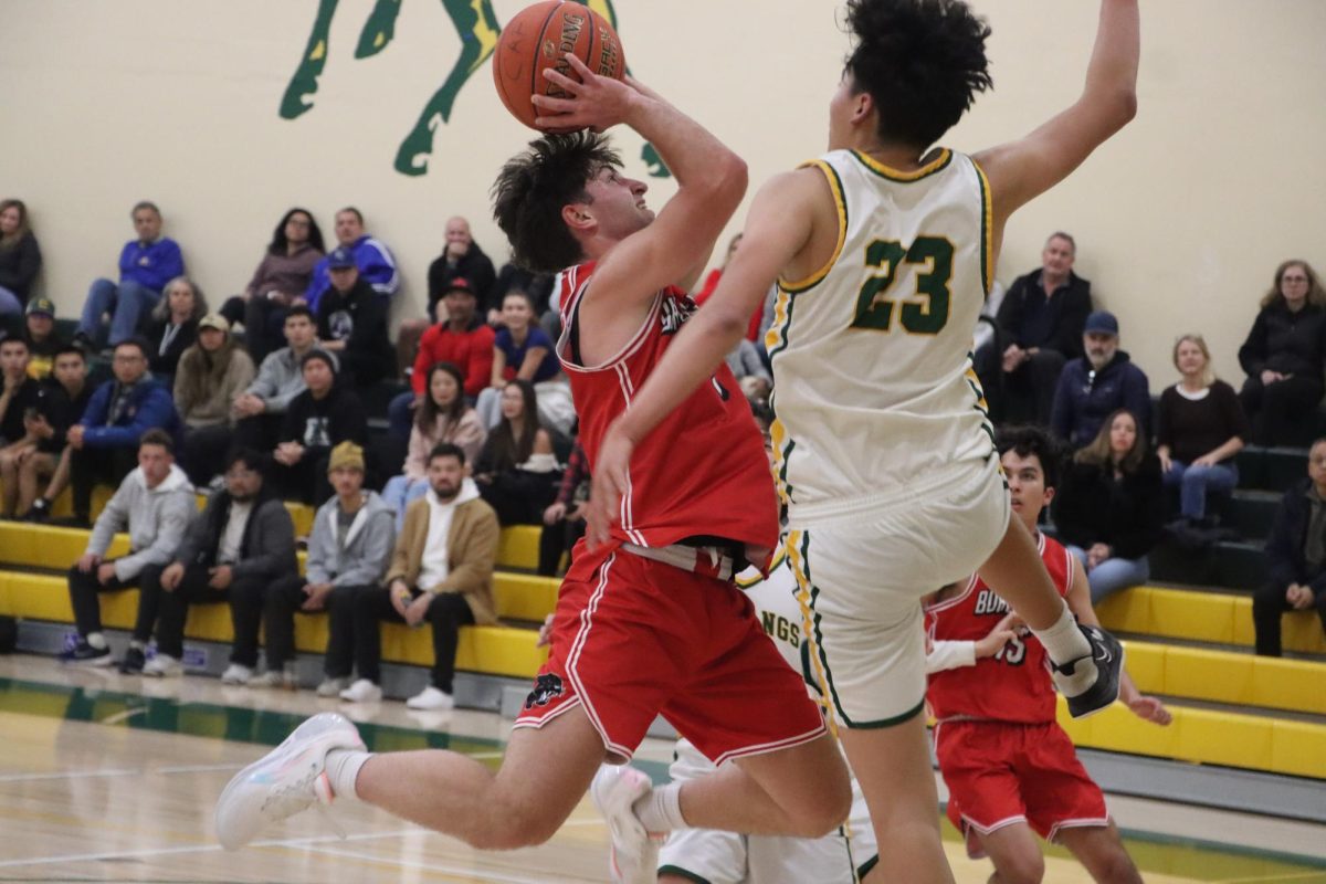 Senior Alain Kazarian drives to the basket through contact against Capuchino. The senior guard is the leading scorer for the Panthers this season, averaging nearly 15 points a game. 