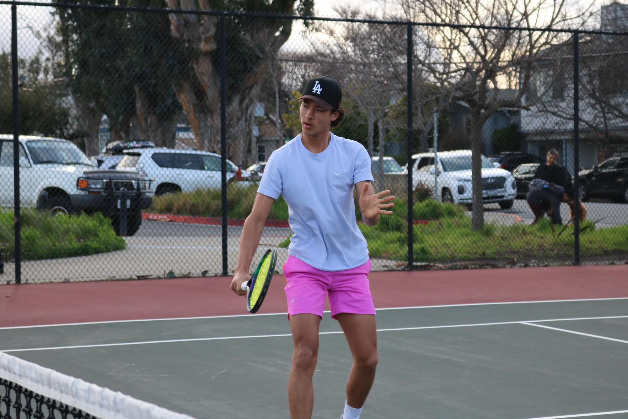 Junior Nicolas Moshkovoy hits a backhand volley while warming up for his tiebreaker on Wednesday, Feb. 21.
