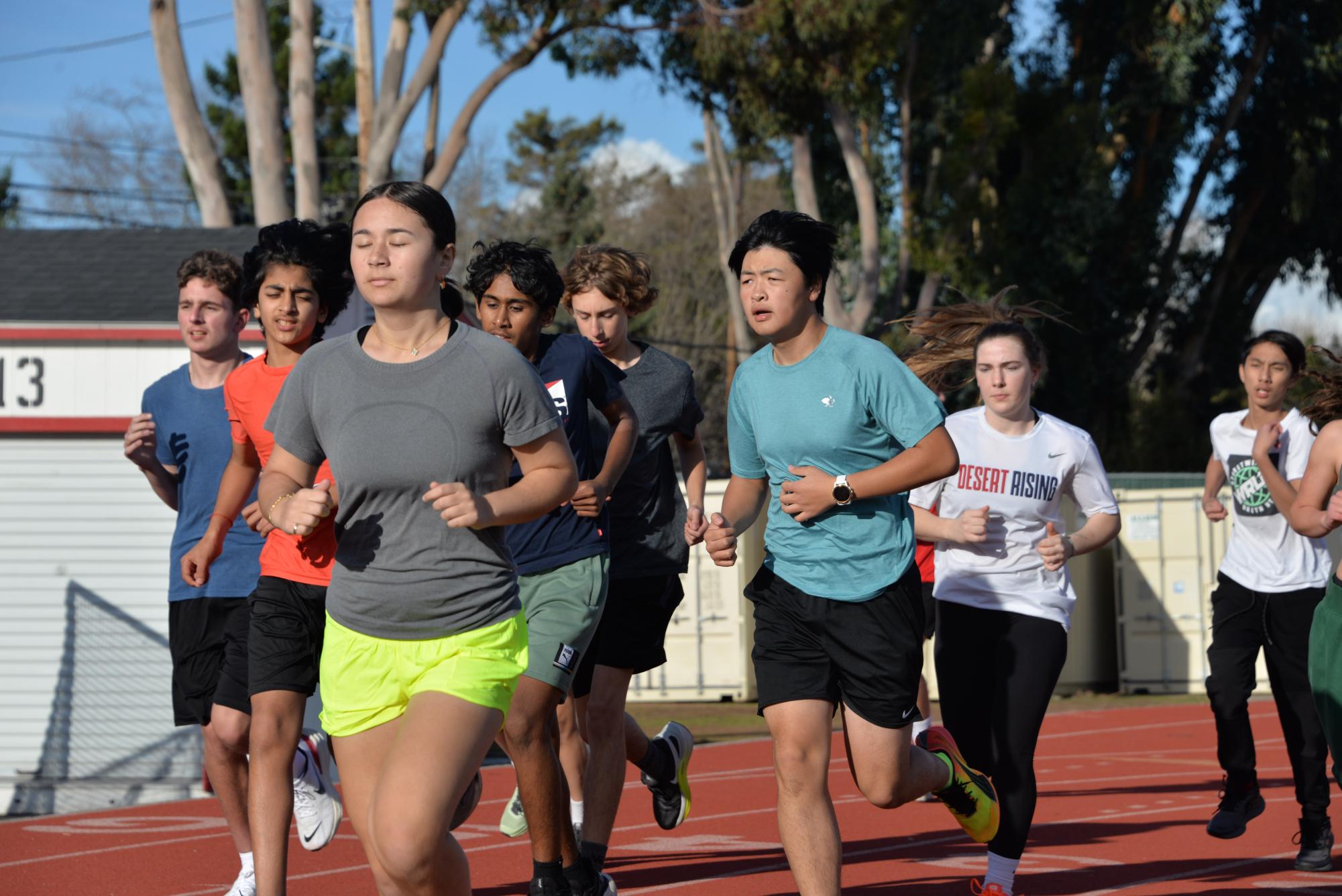 Athletes run a few laps for warm-up during practice on Wednesday, Feb. 28th.  
