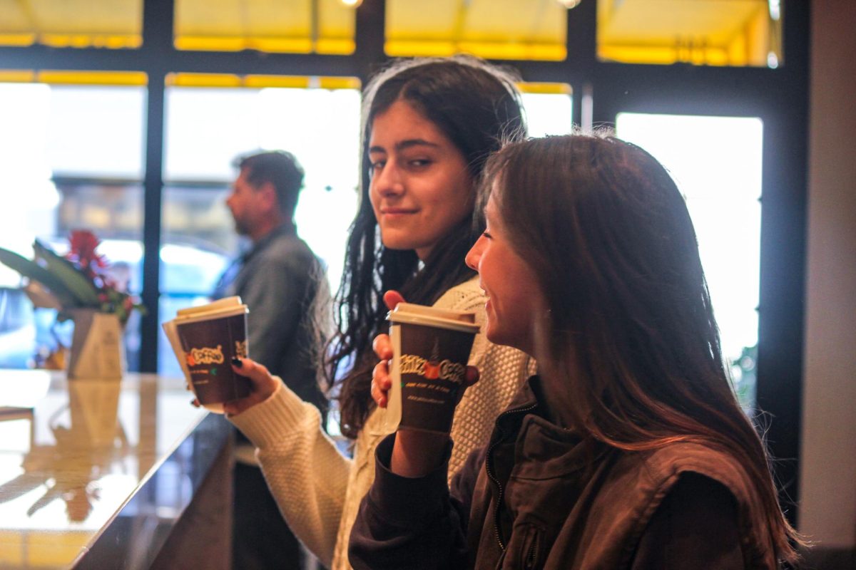 Sophomores Emma Dugoni and Maddie Enriquez enjoy Philz coffee after school on Thursday, Feb. 8.