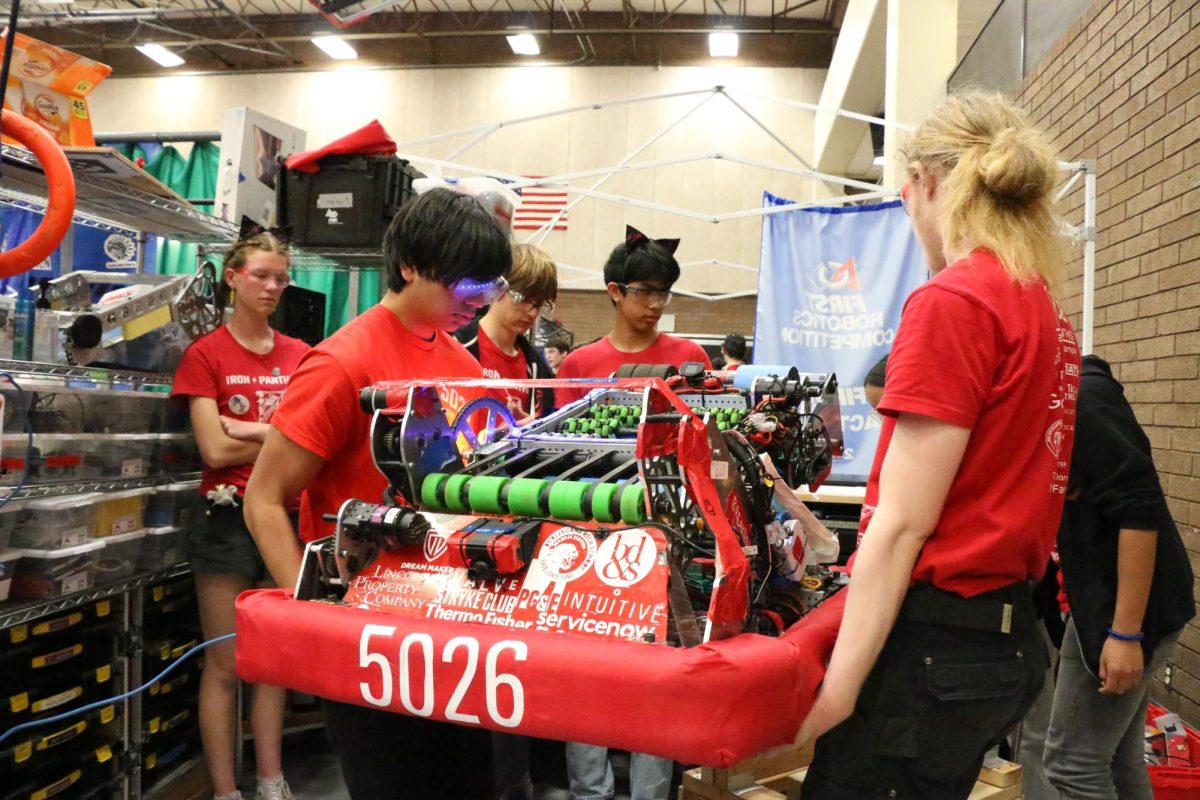 Team members carry the robot out for competition.
