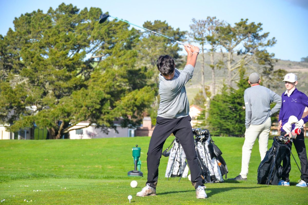 Sophomore Cole Weyer hits a powerful drive from the 5th tee at Half Moon Bay Golf Links during a match against Sequoia High School on Thursday, March 7.